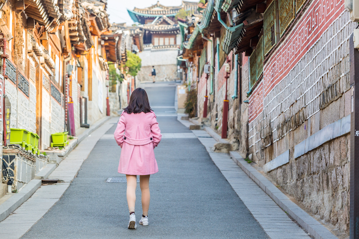girl in pink coat in Bukchon neighbourhood in Seoul, South Korea